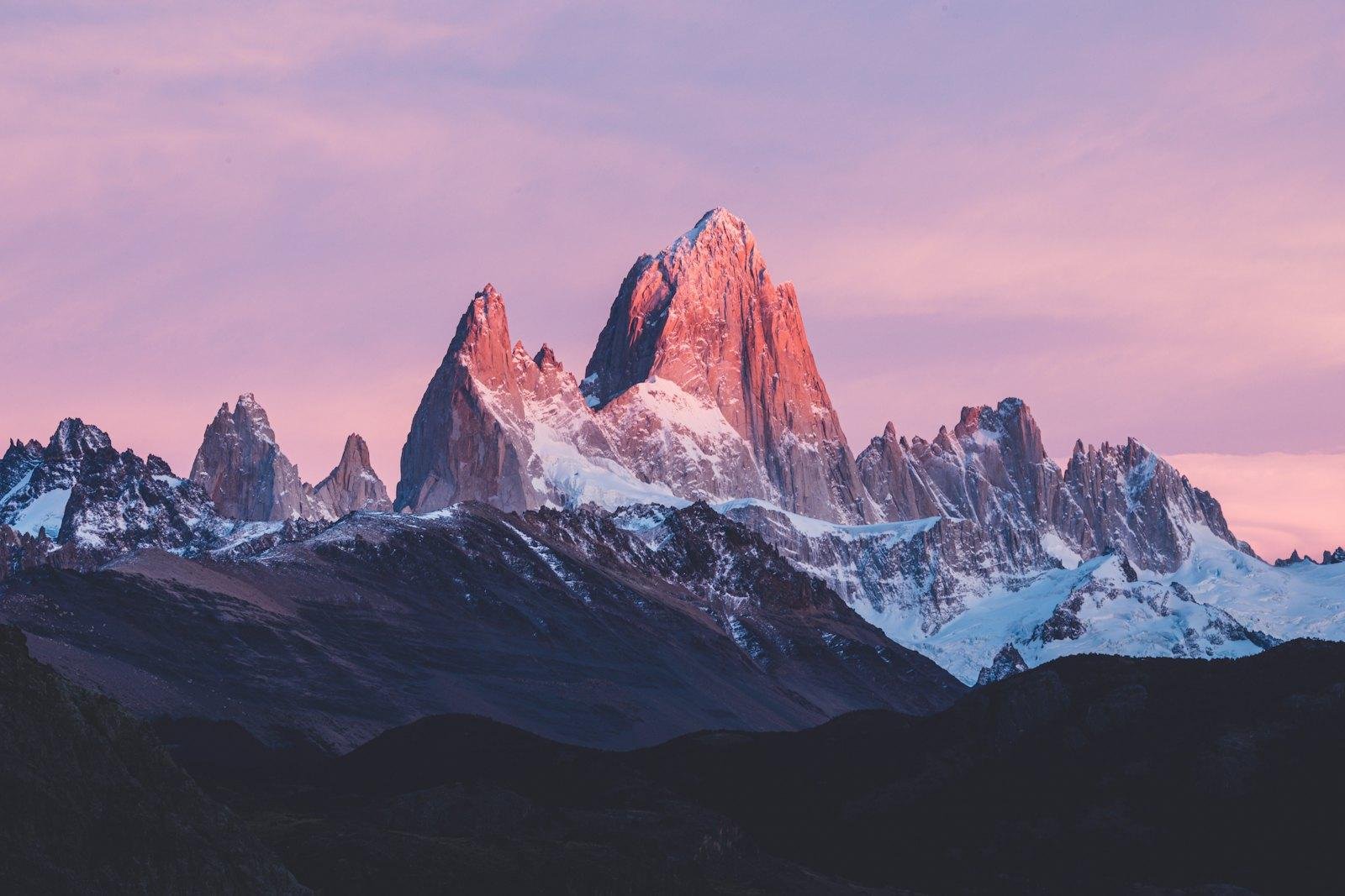 Mount Fitz Roy in Patagonia glowing pink at sunrise